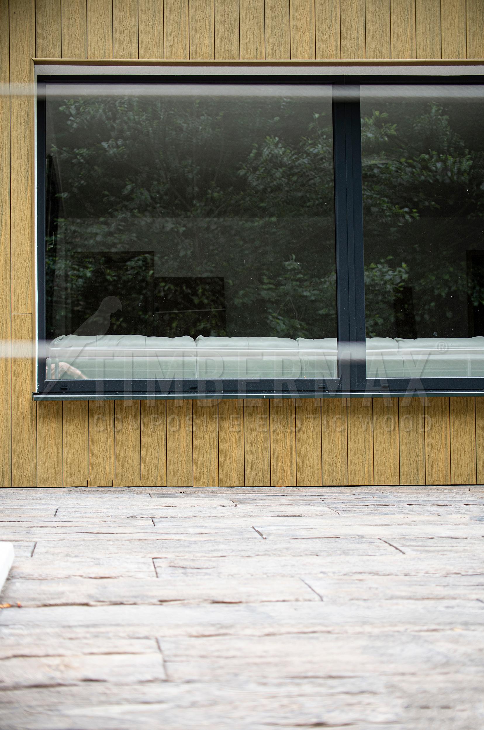 facade coverings imitating wood on the modern facade of the house