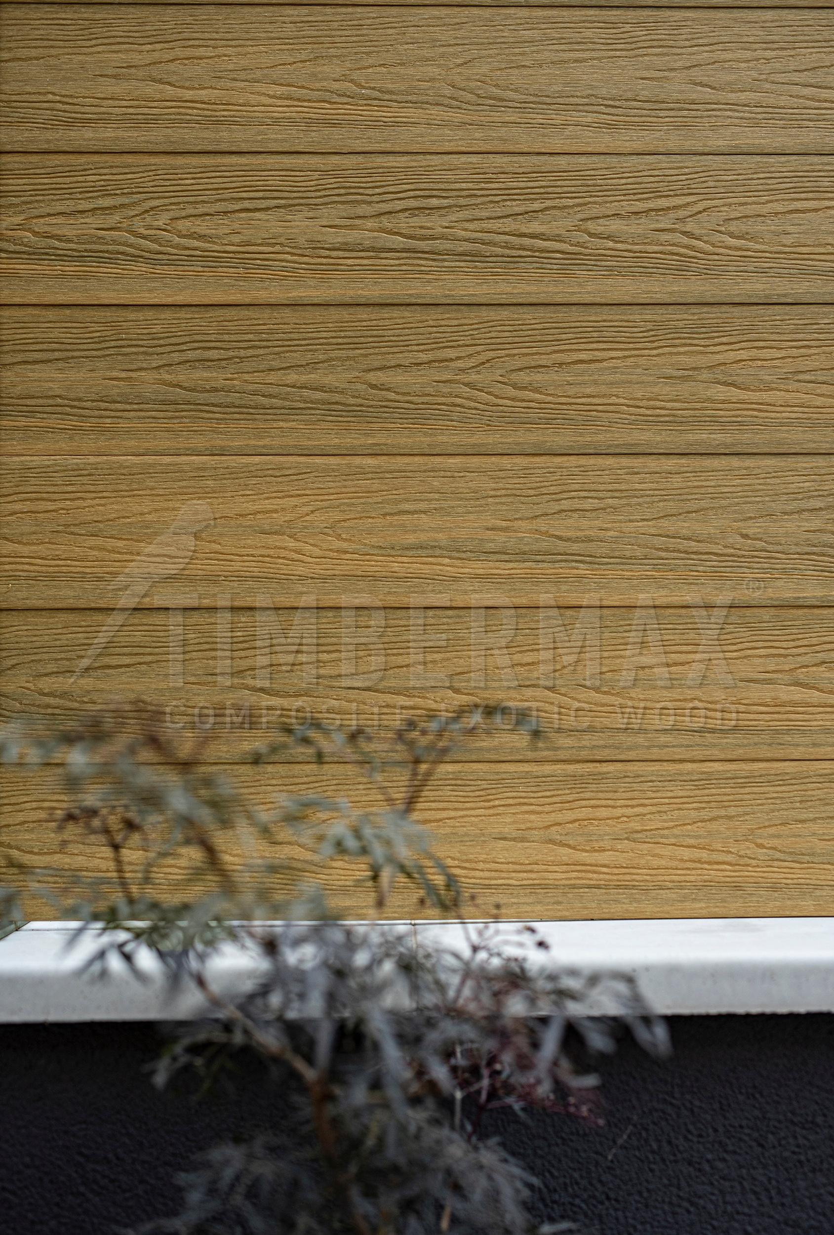 detail of light facade cladding natural wood look on a modern facade