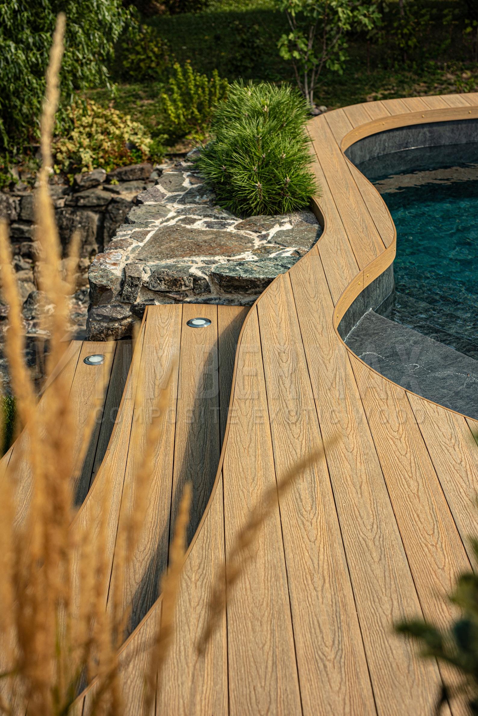 composite decking boards as a swimming pool floor in a modern garden
