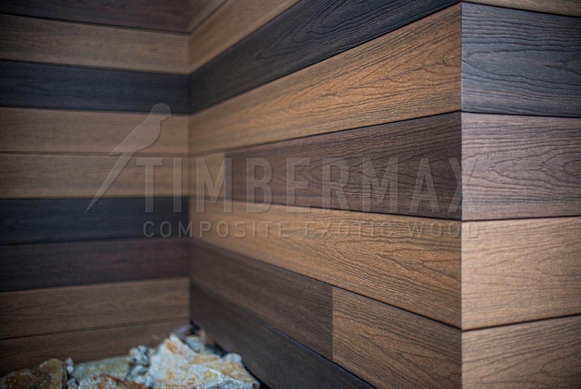 corner of the building with a light imitation wood facade cladding
