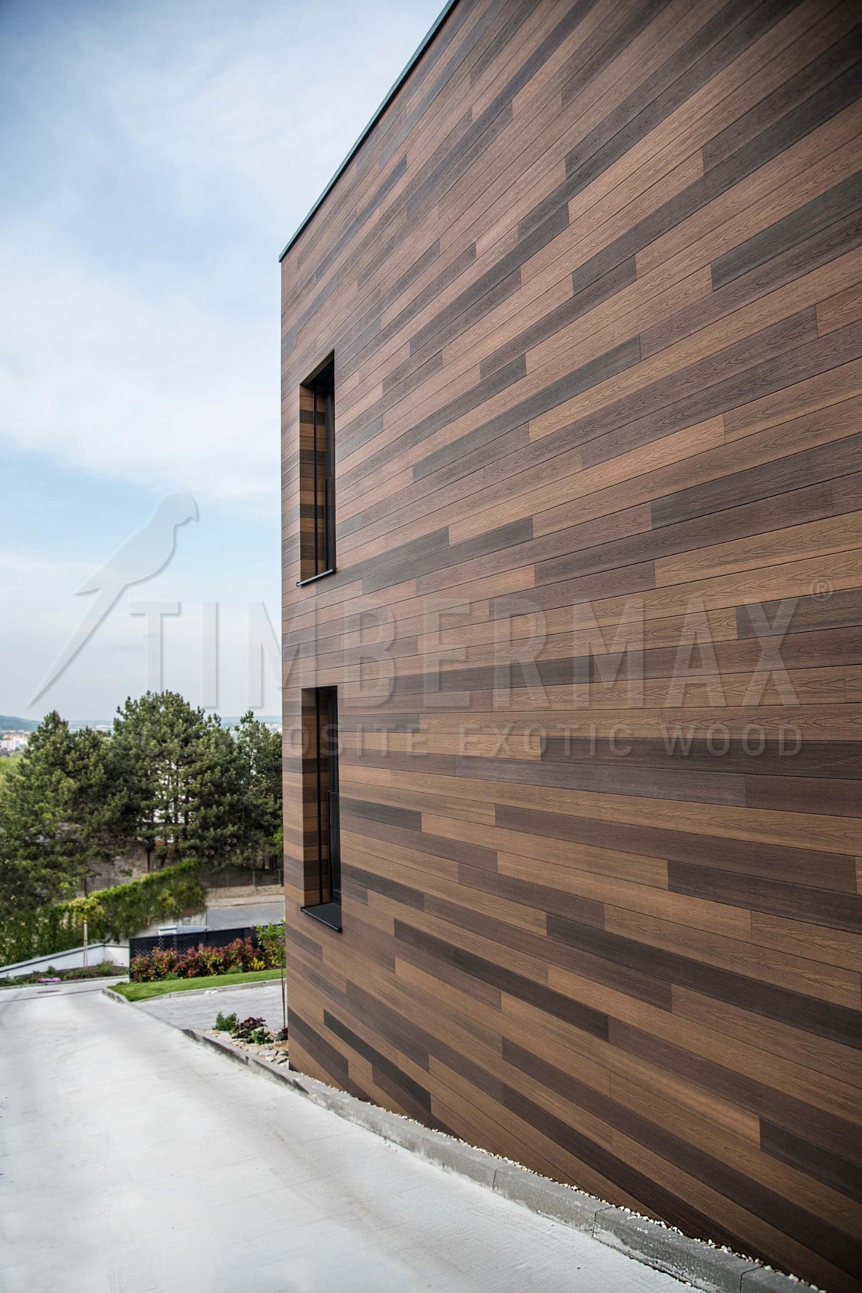 detail of the large-scale facade cladding natural wood look - TIMBERMAX composite facade panels