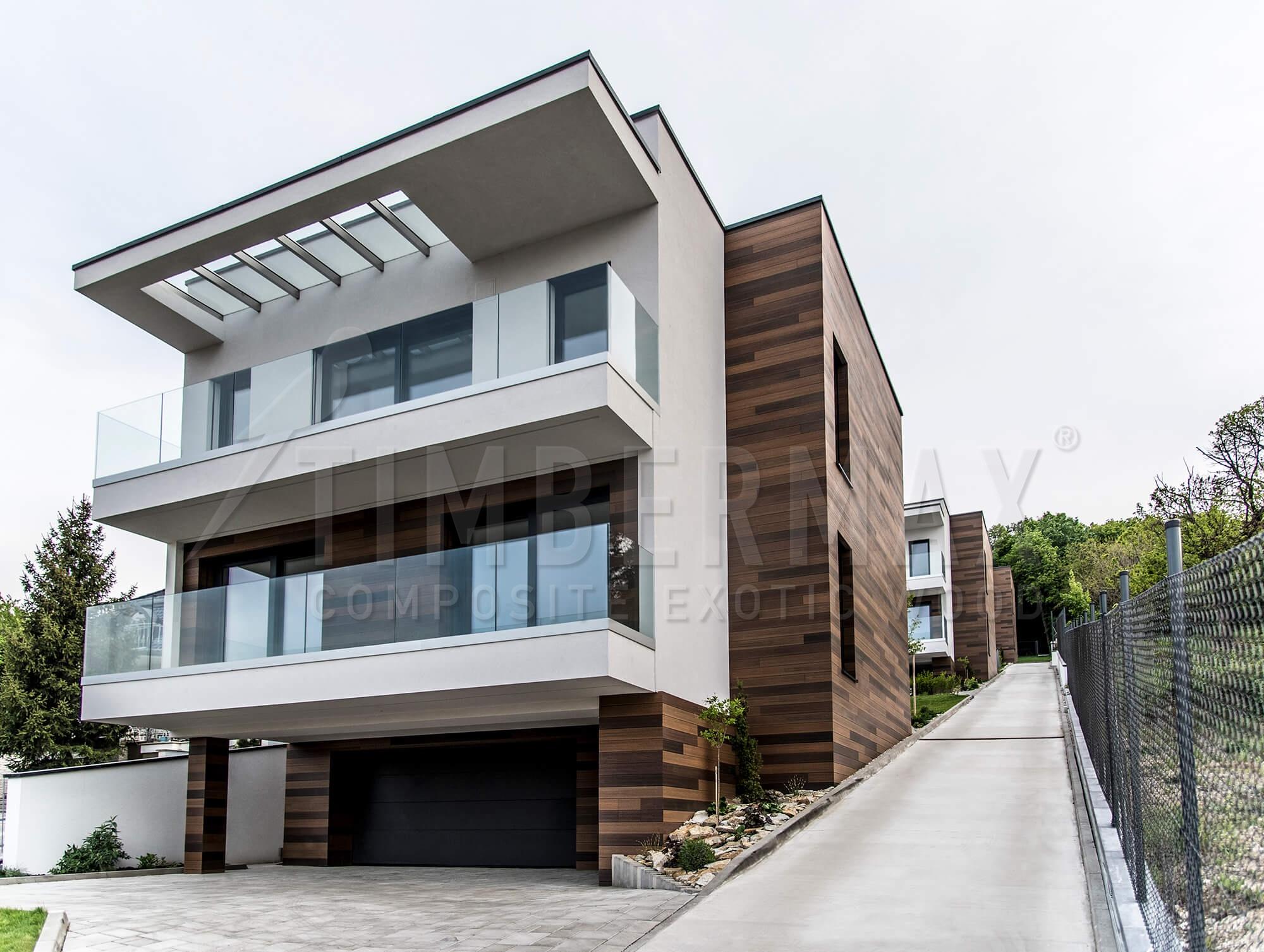 modern apartment building with imitation wood facade cladding made of composite boards