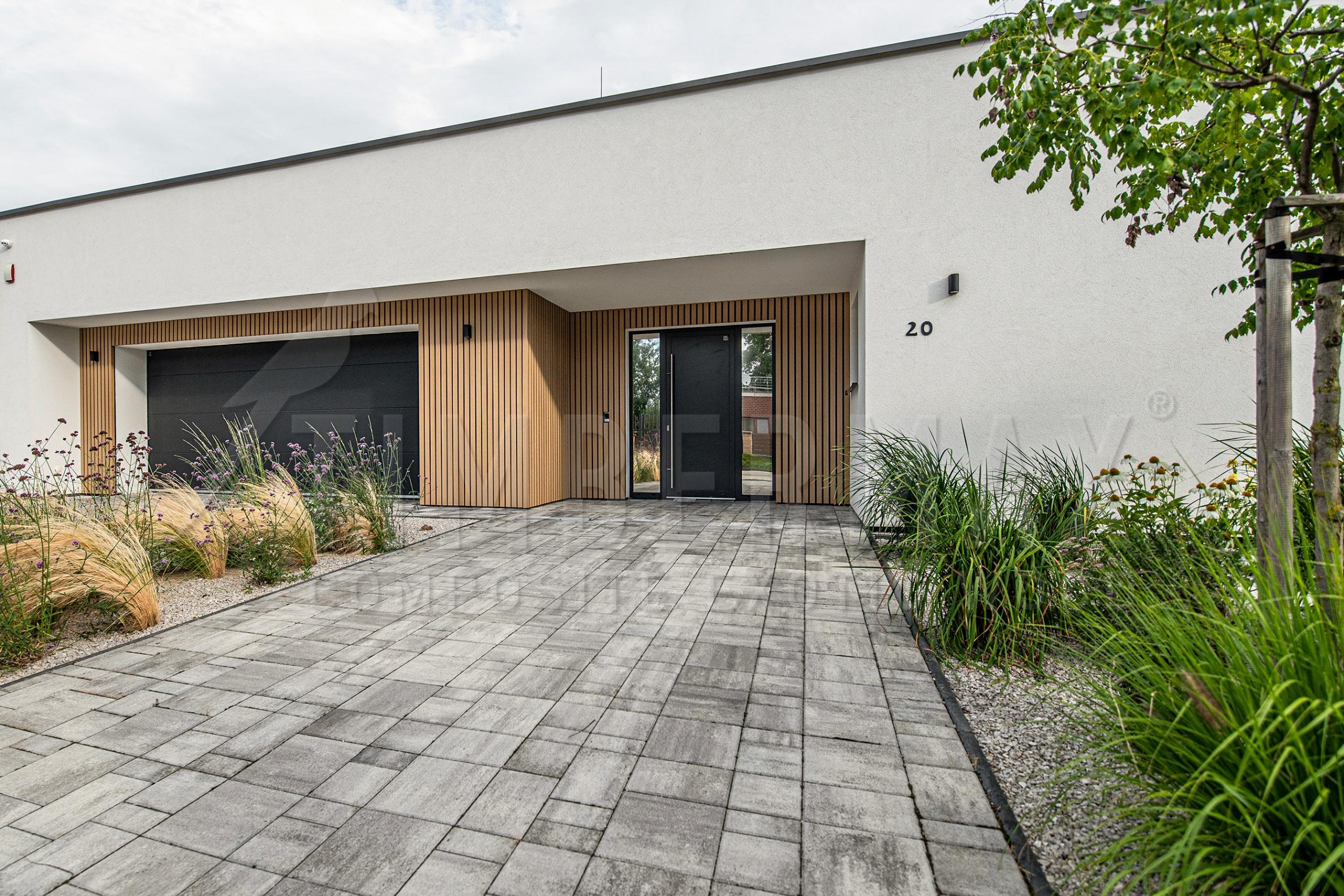 entrance to the house with a vertical slatted facade imitating wood