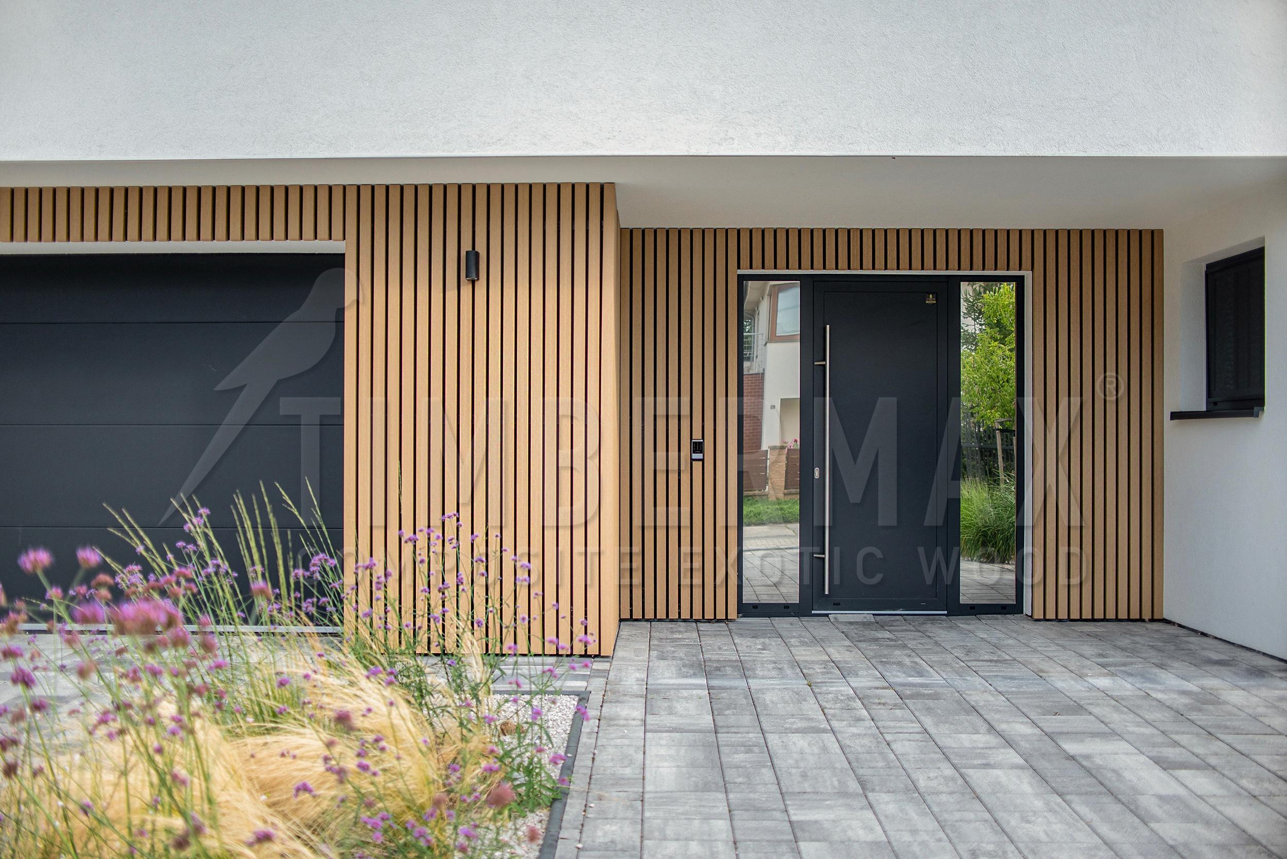 detail of the entrance to the house with a slatted facade imitating wood