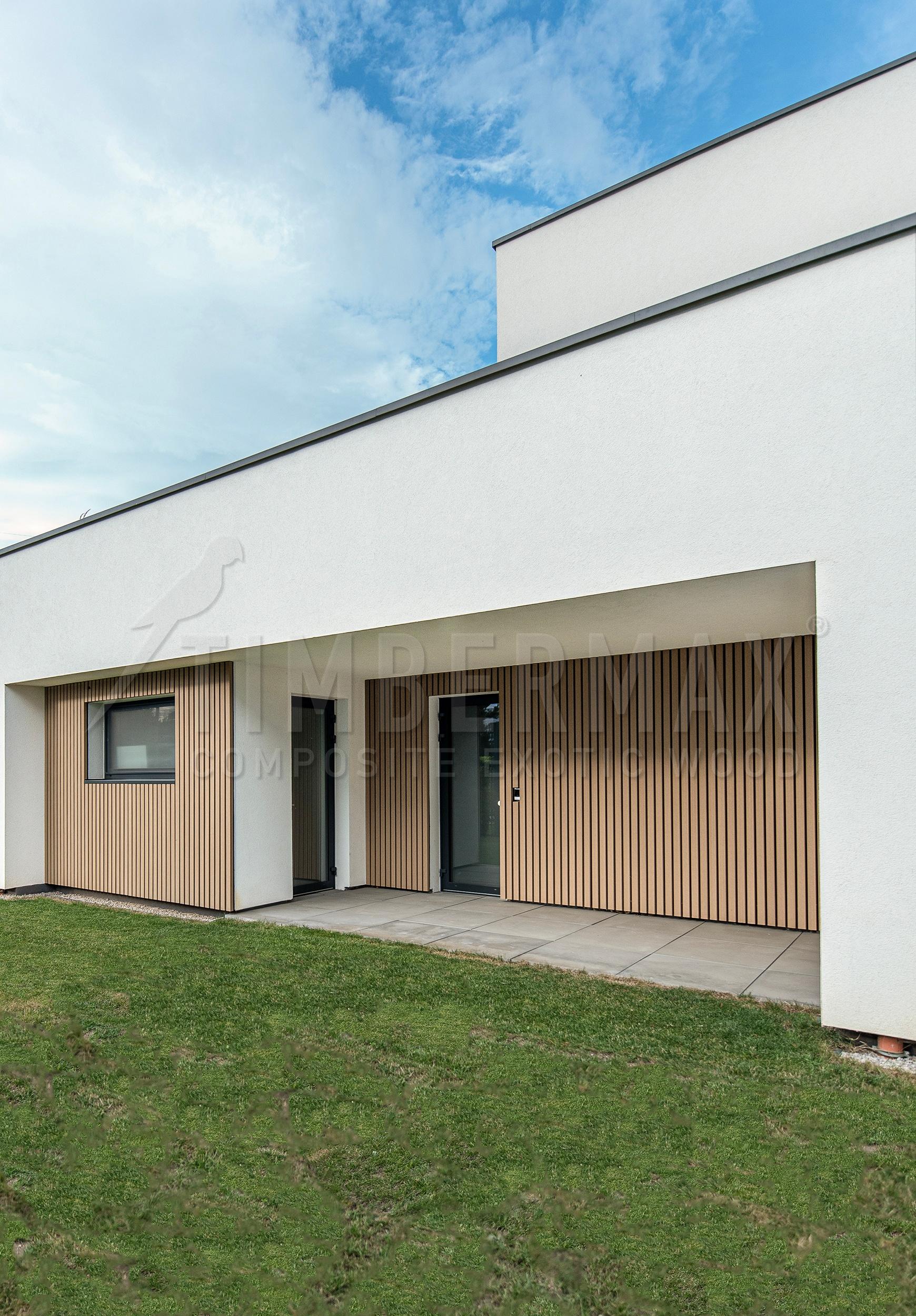 detail of the slatted facade of the house with wood-look