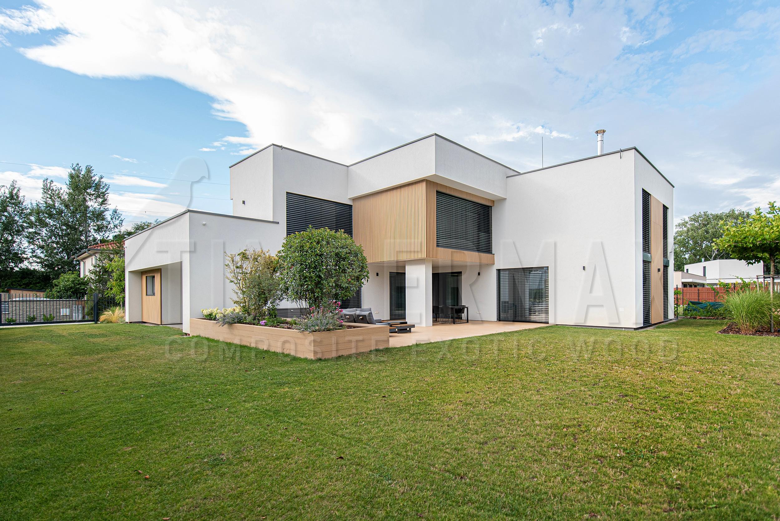modern family house with a slatted facade and a large terrace