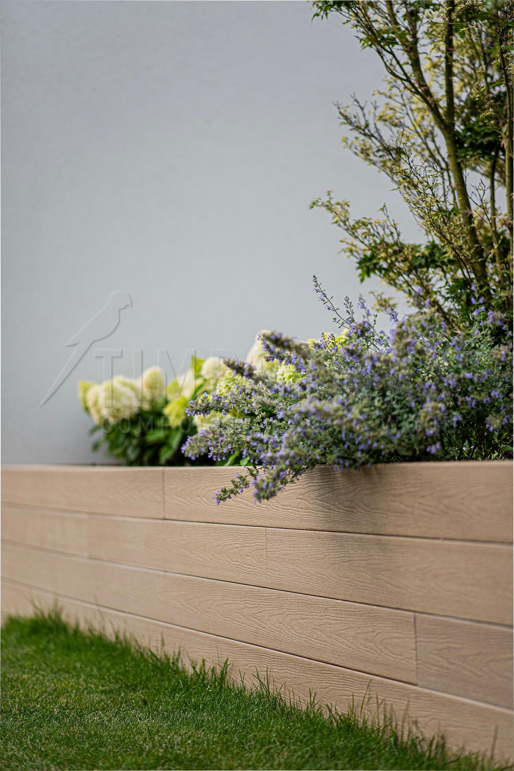 a raised bed made of composite boards for a terrace at a modern family house