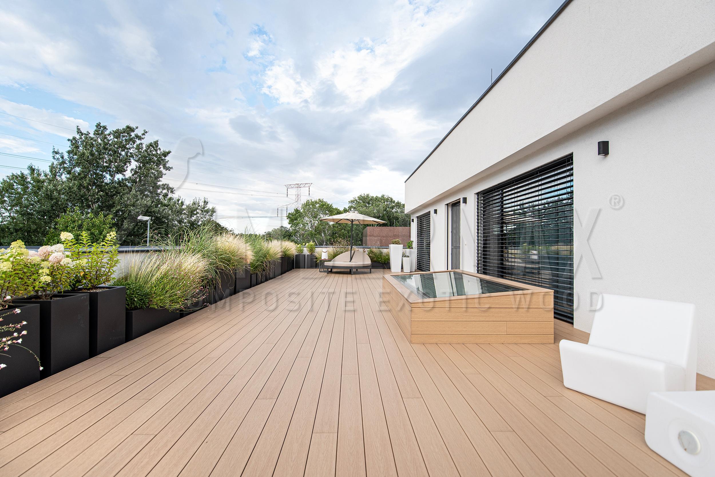 a large terrace made of composite terrace boards at a modern family house