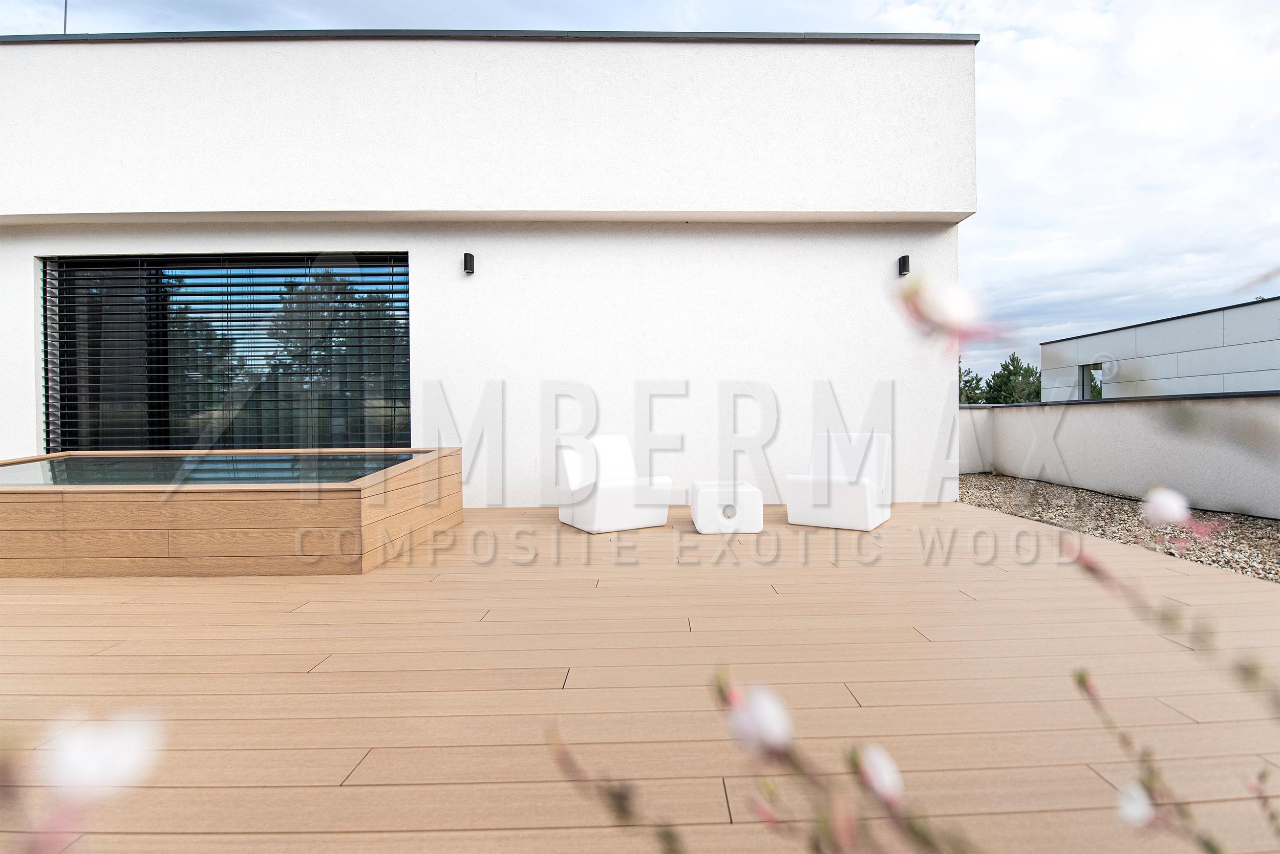 minimalist terrace made of composite terrace boards near the house