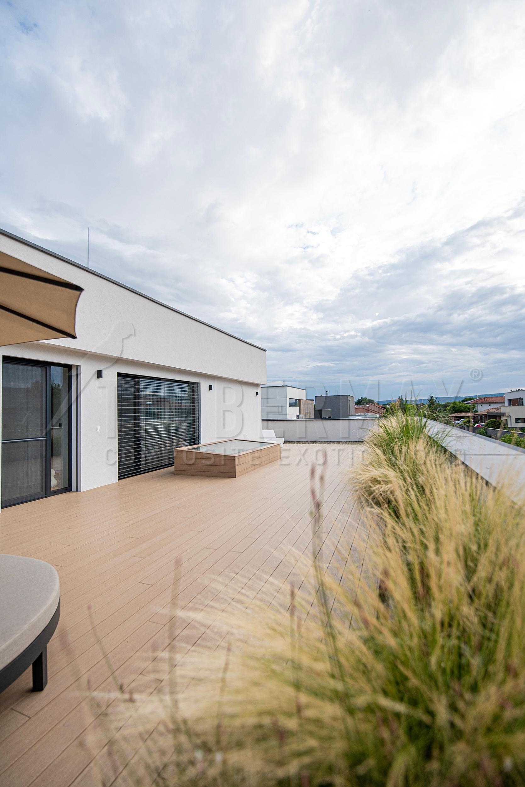 modern terrace with wpc terrace boards and a raised bed