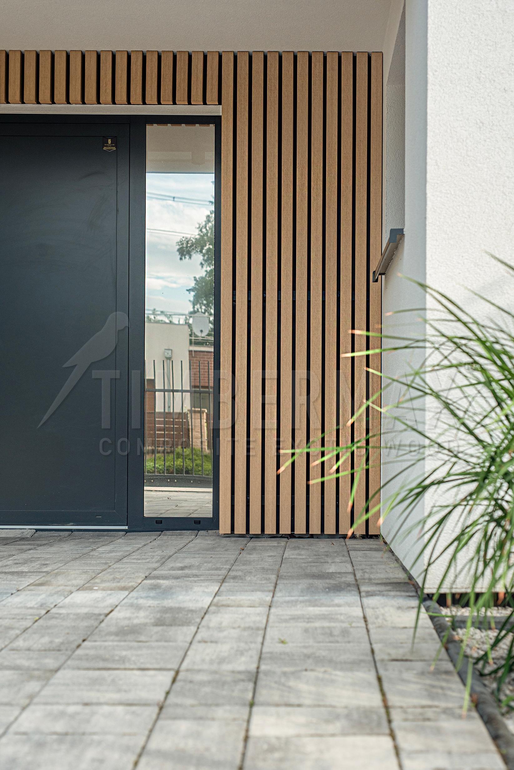 modern entrance to the house with a slatted facade imitating wood