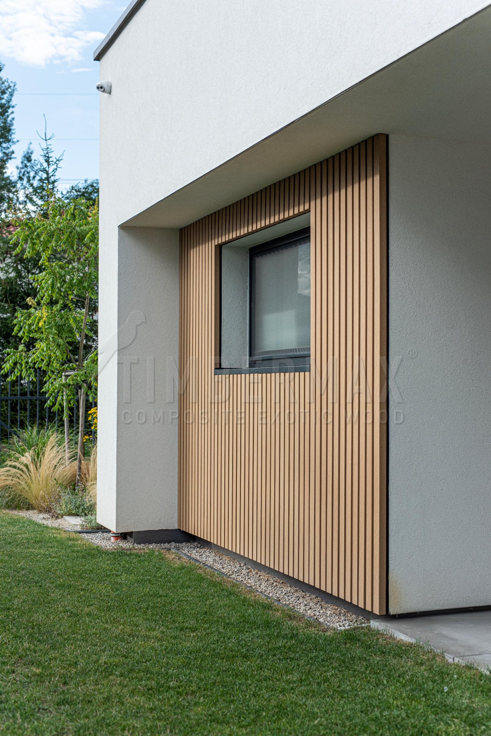 facade cladding made of slats around the window of a modern house