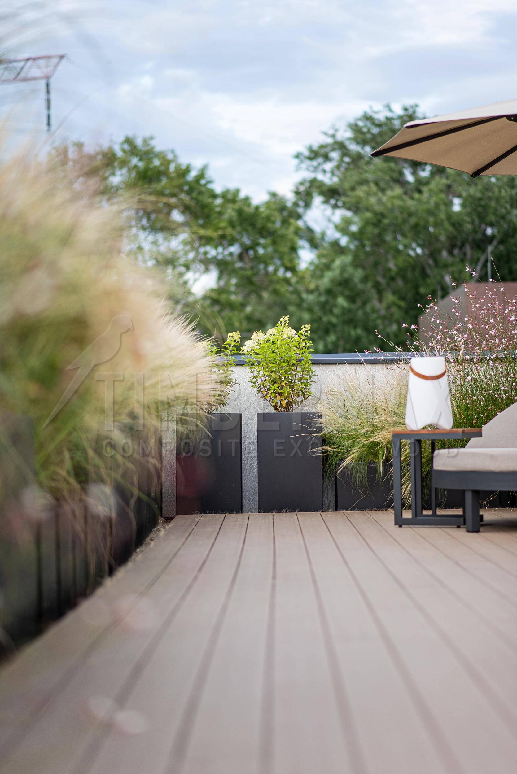 detail of composite decking boards with ornamental plants