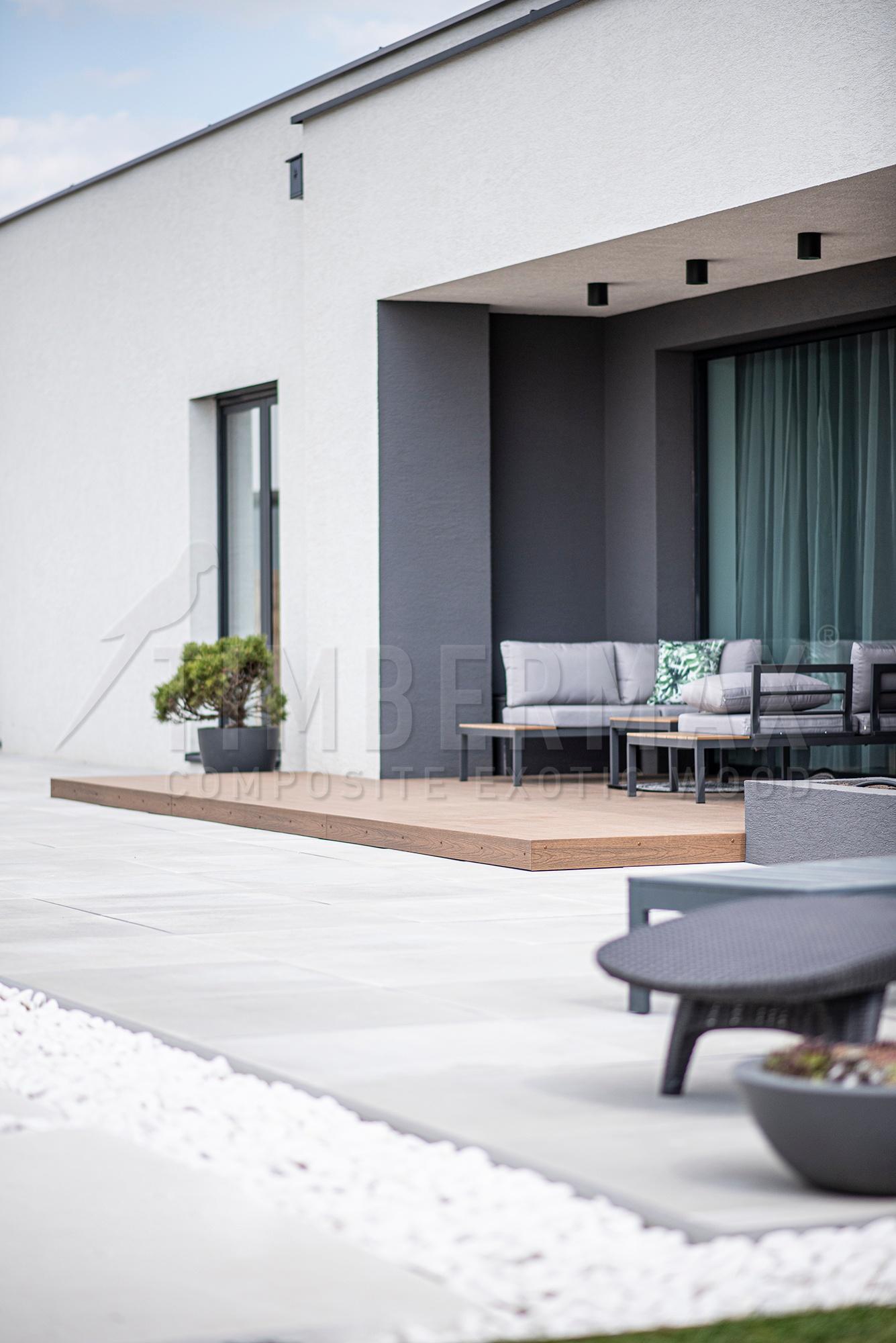 modern terrace made of composite terrace boards at the family house