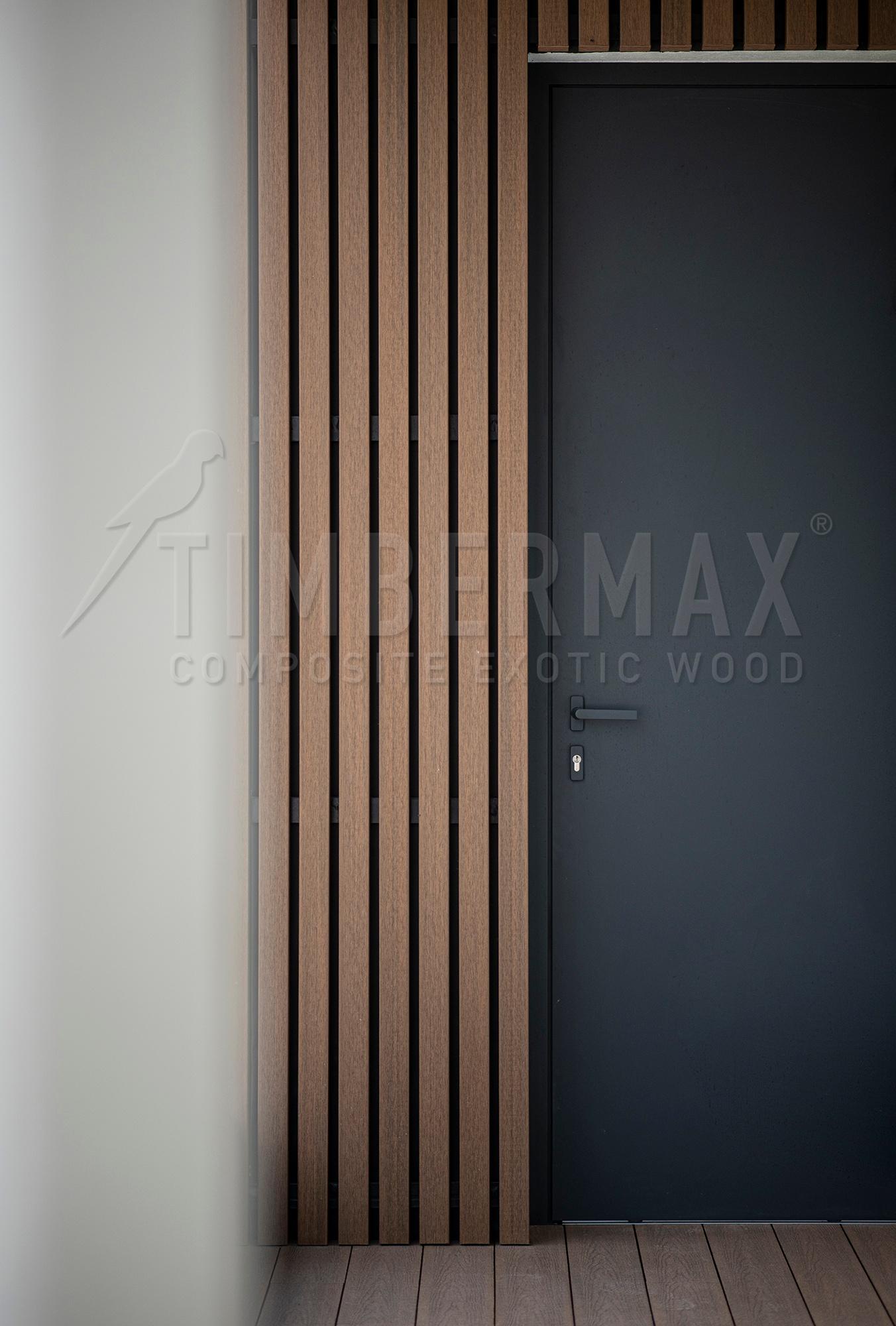 vertical facade cladding made of composite boards at the entrance door