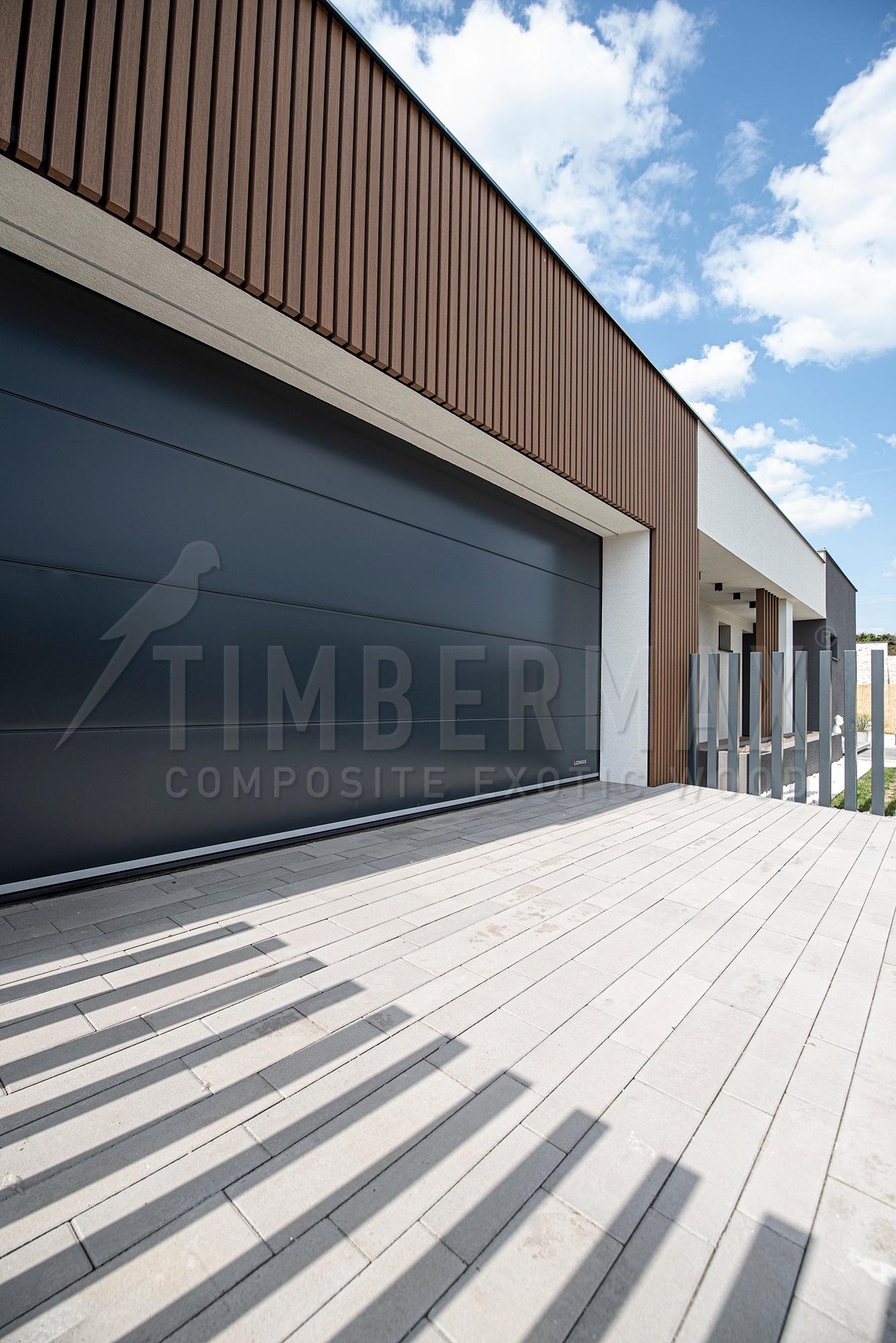 garage and entrance part of the house with a slatted facade imitating wood